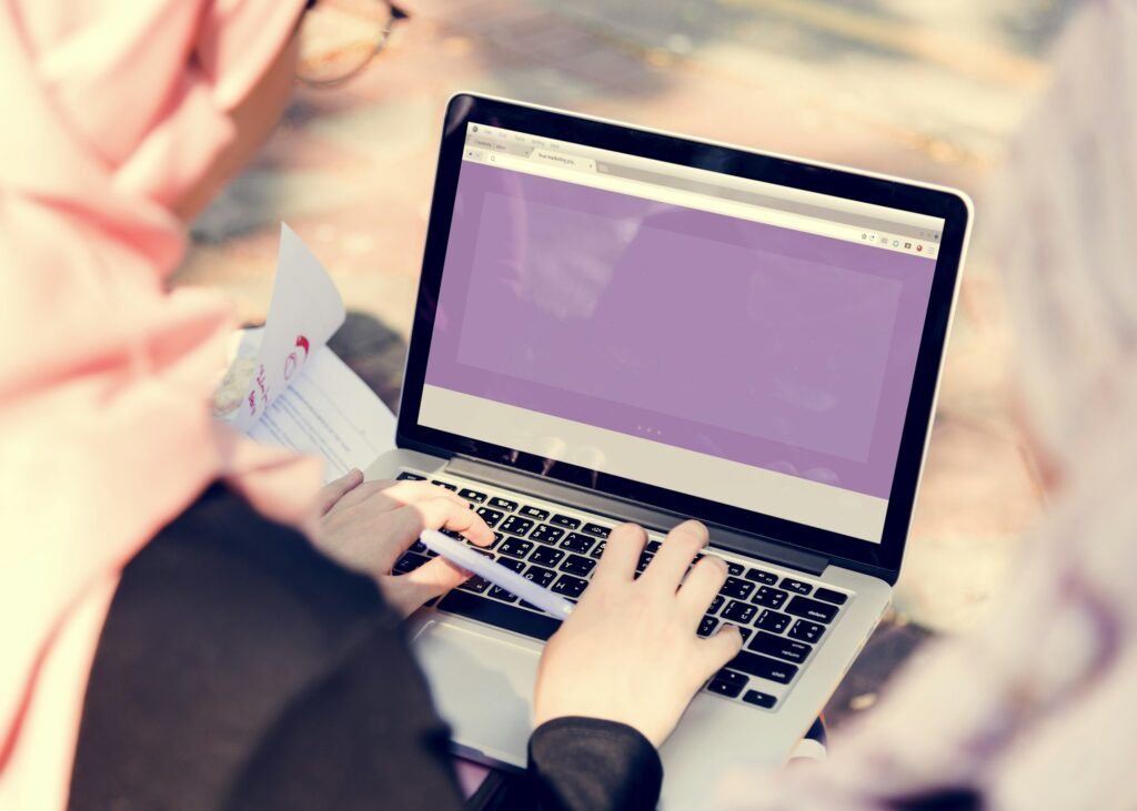 Islamic women searching on laptop